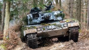 27 January 2022, Bavaria, Hohenfels: A Polish Leopard 2 stands in a wooded area during the international military exercise &quot;Allied Spirit 2022&quot; at the Hohenfels military training area. With helicopters, tanks and infantry, military forces from more than ten countries are training for emergencies at a training area. Photo by: Armin Weigel/picture-alliance/dpa/AP Images