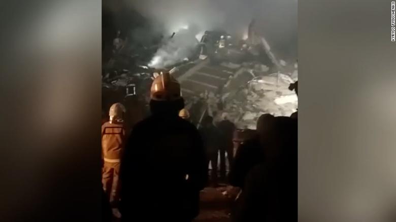 Rescuers call out to woman trapped in rubble after Russian missile strike