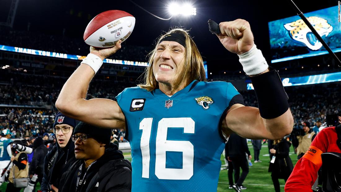 Jacksonville Jaguars quarterback Trevor Lawrence celebrates on the field after completing a massive comeback against the Los Angeles Chargers. Lawrence threw four interceptions -- and also four touchdowns -- as he led the Jaguars back from 27-0 down in the first half to beat the Chargers 31-30 thanks to a last-second field goal.  