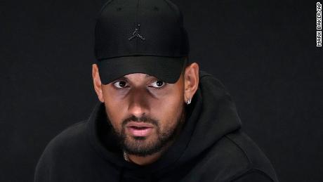 Australia&#39;s Nick Kyrgios reacts as he announces his withdrawal from the 2023 Australian Open with a knee injury at a press conference in Melbourne, Australia.