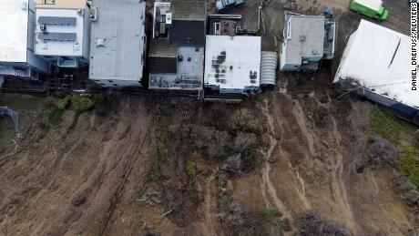 A view of a mudslide and damaged houses after flooding in Aptos, California, Monday.