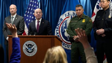 Homeland Security Secretary Alejandro Mayorkas, second from left, looks to responder to a reporter&#39;s question during a news conference. 