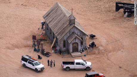 FILE - This aerial photo shows part of the Bonanza Creek Ranch film set in Santa Fe, N.M., on Saturday, Oct. 23, 2021, where cinematographer Halyna Hutchins died from a gun fired by actor Alec Baldwin. The family of a cinematographer shot and killed by Alec Baldwin on the set of the film &quot;Rust&quot; has agreed to settle a lawsuit against Baldwin and the movie&#39;s producers, and production will resume on the project. (AP Photo/Jae C. Hong, File)