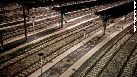Train tracks lie empty at Gare de l&#39;Est railway station in Paris as France is hit by widespread traffic disruption amid a nationwide strike against proposed pension reforms.