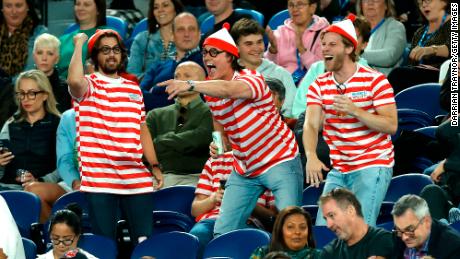 Fans in the crowd dressed up in &#39;Where&#39;s Waldo?&#39; costumes are seen during the match between Djokovic and Couacaud.