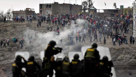 Riot police shoots tear gas at demonstrators seeking to an airport in Arequipa.