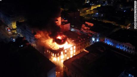 A historic building on fire during the &#39;Take over Lima&#39; march.   