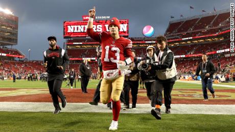 Purdy celebrates as he runs off the field after defeating the Seattle Seahawks on January 14, 2023.