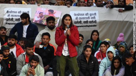 Wrestlers Vinesh Phogat with Sakshi Malik and Bajrang Punia during a protest against the Wrestling Federation of India (WFI) on January 20, 2023 in New Delhi.  