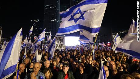 Israeli protesters attend a rally against  Netanyahu&#39;s new  government in Tel Aviv on January 21, 2023.