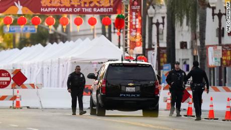 Police officers stand outside a ballroom dance club in Monterey Park, Calif., Sunday, Jan. 22, 2023. A mass shooting took place at a dance club following a Lunar New Year celebration, setting off a manhunt for the suspect. (AP Photo/Jae C. Hong)