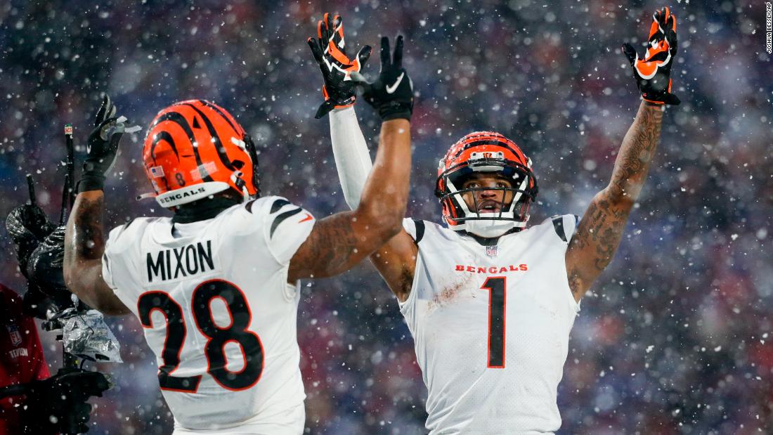 Cincinnati Bengals wide receiver Ja&#39;Marr Chase and running back Joe Mixon motion for a touchdown against the Buffalo Bills during the third quarter. Both Chase and Mixon had TDs as the Bengals convincingly beat the Bills 27-10 to advance to the AFC Championship game. 