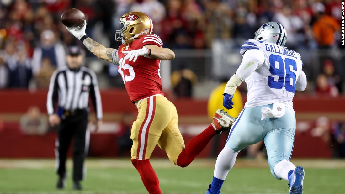 George Kittle of the San Francisco 49ers catches a pass against the Dallas Cowboys during the third quarter. The 49ers&#39; defense -- which picked off Cowboys quarterback Dak Prescott twice -- helped stymie Dallas in a 19-12 victory to move San Francisco to the NFC Championship game.