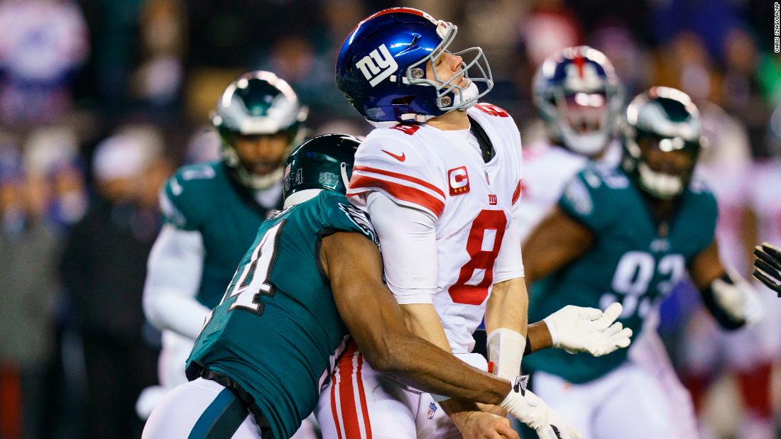 New York Giants quarterback Daniel Jones loses the ball while under pressure by Philadelphia Eagles defensive end Josh Sweat. The Eagles thoroughly dominated the Giants, winning 38-7, to advance to play the 49ers in the NFC Championship game. 
