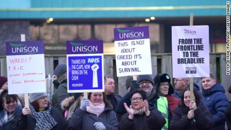 Ambulance workers stand on the picket line outside Aintree University Hospital in Liverpool on Monday, January 23. More strikes are planned for the weeks ahead.