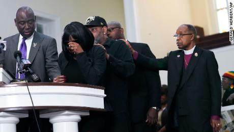 The mother of Tyre Nichols cries as she is comforted by Nichols&#39; stepfather at a news conference in Memphis Monday. 