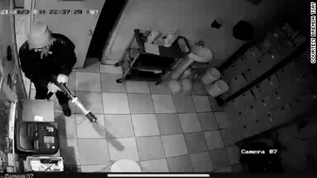 Security footage shows the suspect entering a door. 