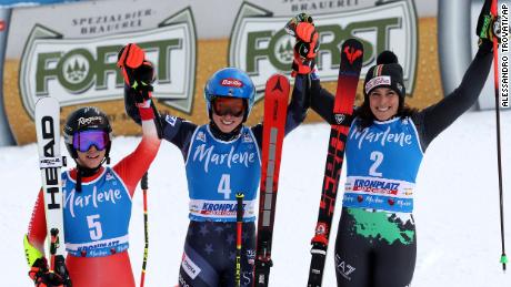 Shiffrin (center) celebrates her giant slalom victory at Kronplatz with second-placed Lara Gut-Behrami (left) and Federica Brignone (right).