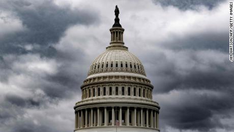 Storm clouds pass over the US Capitol in Washington, DC, on January 23, 2023. 