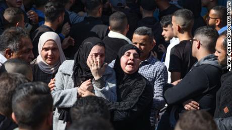 Family members of one of the Palestinian people killed during the Israeli raid on January 26, 2023 mourn his death during his funeral procession in Jenin.
