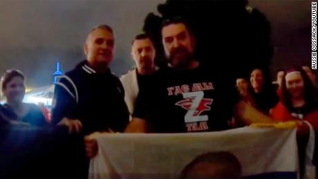 Novak Djokovic&#39;s father Srdjan was seen posing with flag-waving supporters of Russian President Vladimir Putin at the Australian Open in this image taken from a video on January 26.