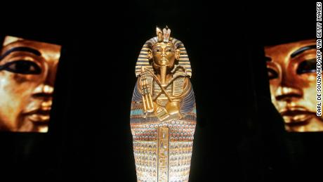 The coffinette for the Viscera of Tutankhamun (C) is pictured at the Tutankhamun exhibition at the 02 centre in London, 13 November 2007. The lid was lifted Tuesday on a long-awaited new exhibition of treasures from the tomb of teenage Egyptian pharaoh Tutankhamun in London. Some 130 items which are up to 3500 years old are on show at "Tutankhamun and the Golden Age of the Pharoahs", including the boy king's gold crown and a coffinette which contained his mummified internal organs. AFP PHOTO/CARL DE SOUZA (Photo by Carl DE SOUZA / AFP) (Photo by CARL DE SOUZA/AFP via Getty Images)