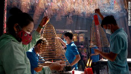 People pray over incense at Thien Hau Pagoda for the Tet Lunar New Year on January 24 in Ho Chi Minh City, Vietnam.
