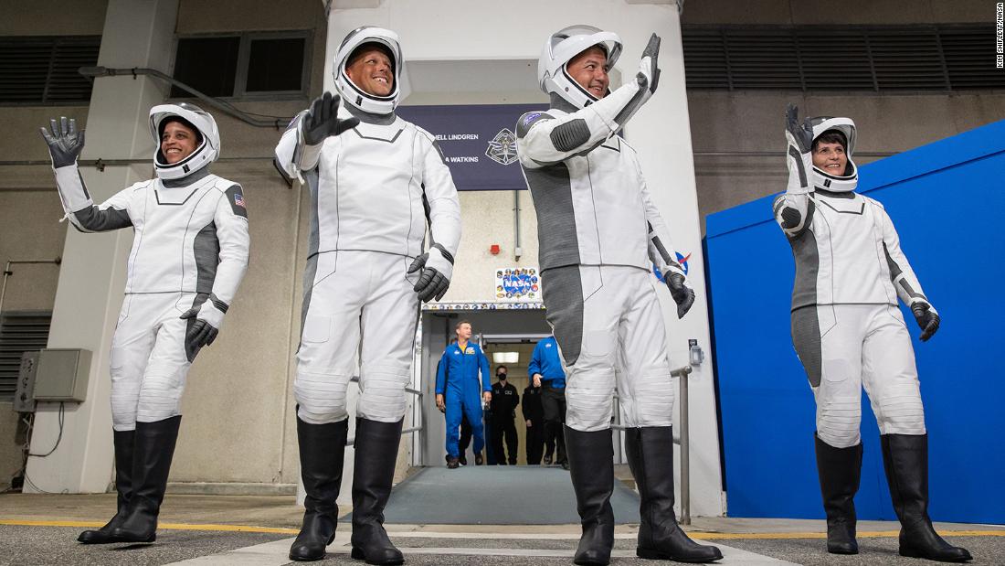 Watkins (from left) and crewmates Bob Hines, Kjell Lindgren and  Samantha Cristoforetti walk out of the crew quarters at Kennedy Space Center before their April 27 launch to the space station. 