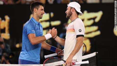 Djokovic and Paul embrace at the net after their Australian Open semifinal. 