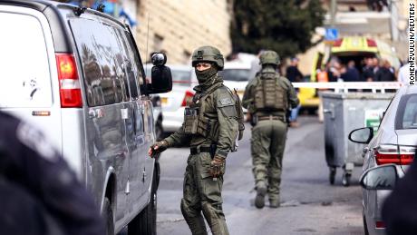 Israeli security personnel work near the scene of Saturday&#39;s shooting. 