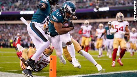 Philadelphia Eagles running back Boston Scott, center, runs for a touchdown during the first half of the NFC Championship game between the Eagles and the San Francisco 49ers on Sunday, Jan. 29, 2023, in Philadelphia. 