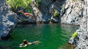 The island is known for its &apos;vathres,&apos; or waterfall-fed pools.