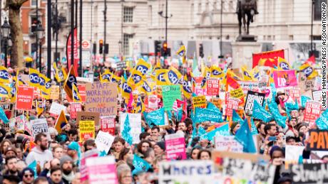 Striking workers march in London on February 1, 2023 over pay, working conditions and a controversial government bill that will curb the right to strike.