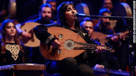 A musician with Iraq&#39;s National Band for Musical Heritage performs during a concert marking the 100th anniversary of the death of Iraqi composer Mulla Uthman Al-Mawsili, at the National Theatre in Baghdad on January 30. 