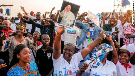 People wait for the arrival of Pope Francis at N&#39;Dolo Airport in Kinshasa in the Democratic Republic of the Congo on Wednesday.
