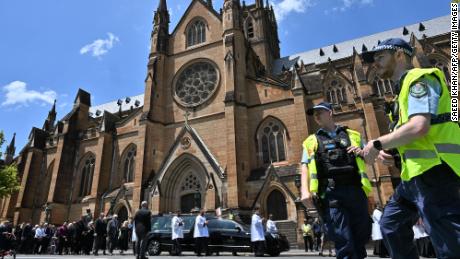 Police officers are seen outside St. Mary&#39;s Cathedral on Thursday.