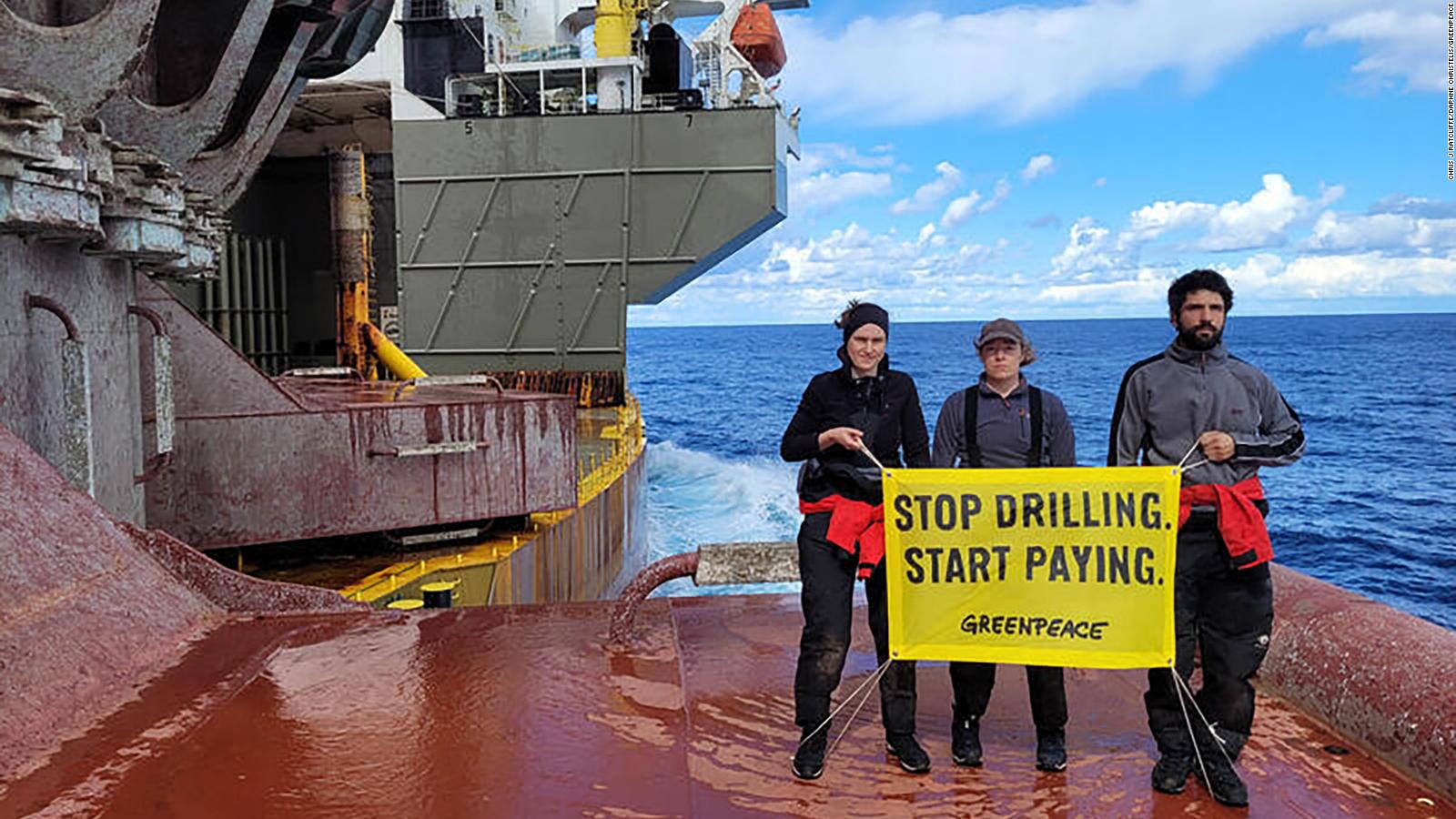 greenpeace-activists-scale-shell-oil-platform-in-the-atlantic-ocean-as-company-announces-record