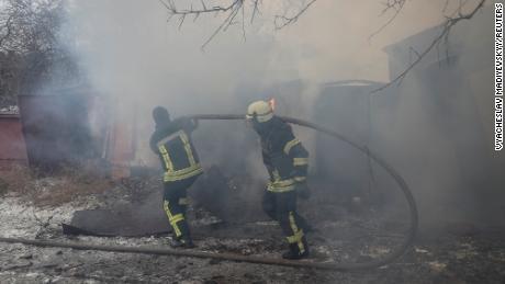 Rescuers work at the site of a Russian missile strike Thursday in Kramatorsk.