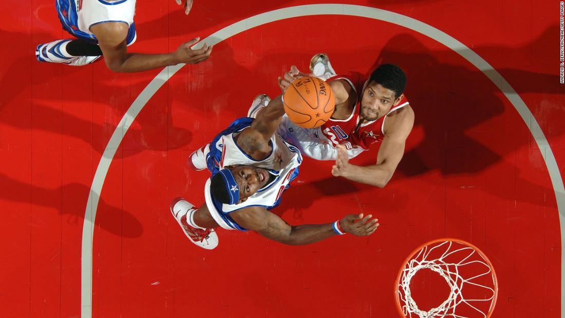 James, center, goes up for a rebound with Tim Duncan during the 2006 NBA All-Star Game. He was named the game&#39;s most valuable player — the youngest to ever receive the award.