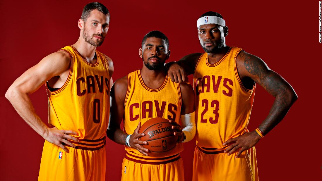 James poses with his new &quot;Big 3&quot; in Cleveland: Kevin Love, left, and Kyrie Irving.