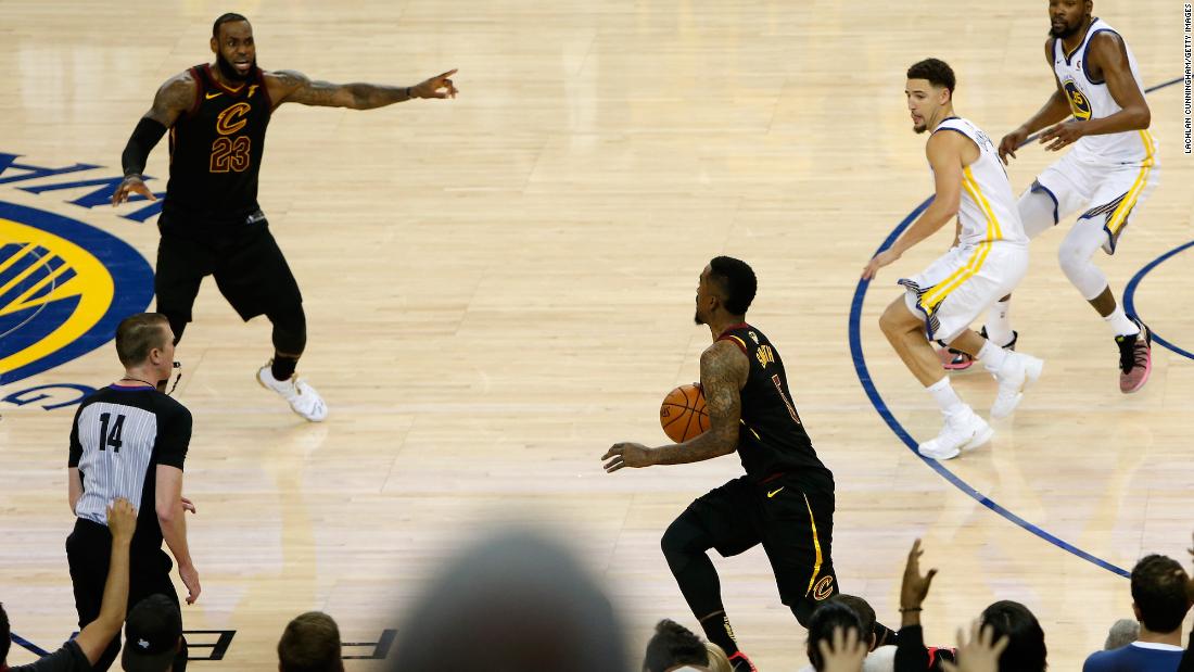 James tries to direct teammate J.R. Smith on a last-second play in the 2018 NBA Finals. The Cavaliers and the Warriors played in four straight NBA Finals, from 2015 to 2018. The Warriors won three of the four.
