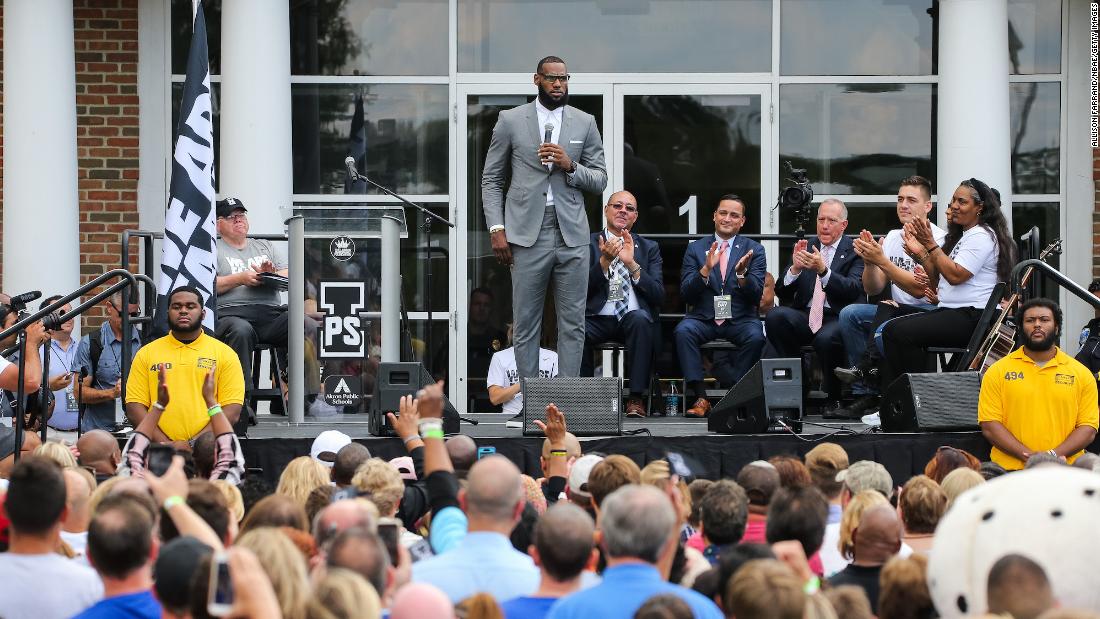 James addresses a crowd at the grand opening of his &quot;I Promise&quot; school in Akron in July 2018. James&#39; foundation teamed with the Akron Public Schools system to open a school supporting at-risk children.