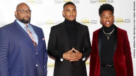 Hurts stands with his father Averion (left) and his brother Averion Jr. (right) during his time with Oklahoma before the National Quarterback Club Awards Dinner &amp; Hall of Fame Induction Ceremony The Scottsdale Resort at McCormick Ranch in Scottsdale, Ariz. on January 19, 2019.