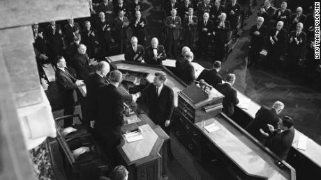 President Kennedy shakes hands with House Speaker John McCormack, D-Mass., on Jan. 11, 1962 in Washington after delivering his State of the Union address to a joint session of the 87th Congress in the House chamber. Beside McCormack is Vice President Lyndon Johnson. (AP Photo)