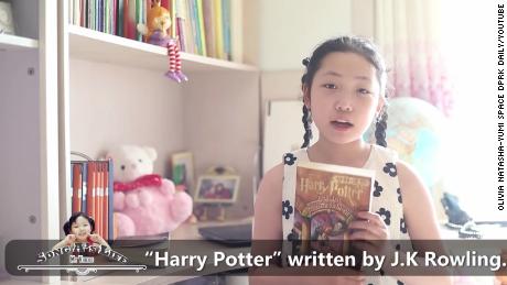 Song A, purportedly a resident of Pyongyang, North Korea, holds up a Harry Potter book in a YouTube video uploaded April 26, 2022.