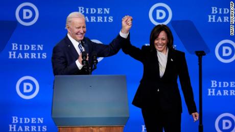 President Joe Biden and Vice President Kamala Harris hold their hands up at the Democratic National Committee winter meeting, Friday, Feb. 3, 2023, in Philadelphia. (AP Photo/Matt Rourke)