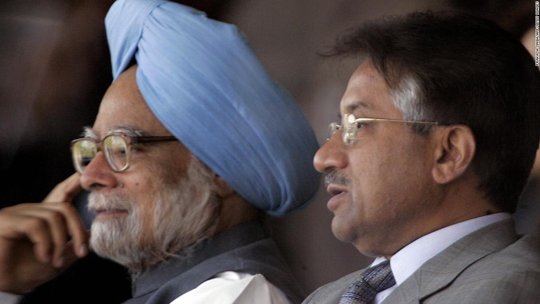 Musharraf sits next to Indian Prime Minister Manmohan Singh while watching a cricket series between India and Pakistan in 2005.