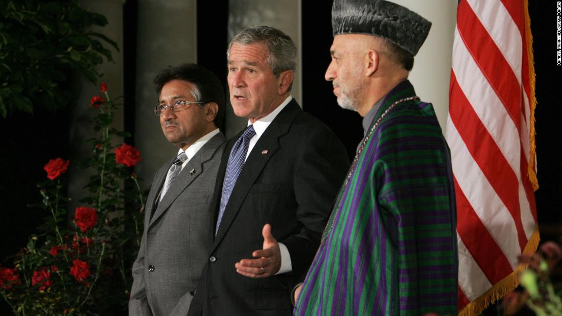 Bush speaks beside Musharraf and Afghan President Hamid Karzai after a White House meeting in September 2006.