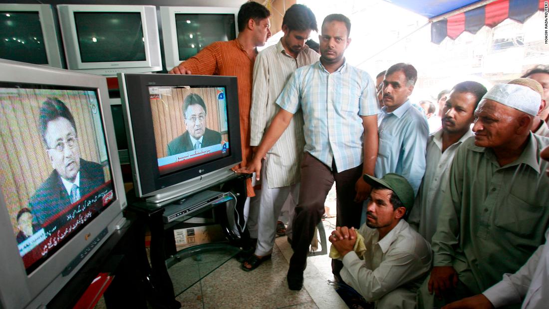 People in Lahore watch Musharraf&#39;s resignation speech on August 18, 2008. Musharraf announced his resignation in the face of an impending impeachment motion by the ruling coalition government.