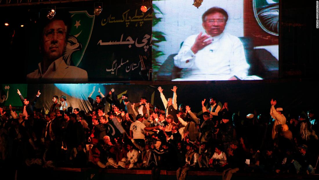 Supporters of the All Pakistan Muslim League, a political party founded by Musharraf, watch him give a speech from Dubai in January 2012.
